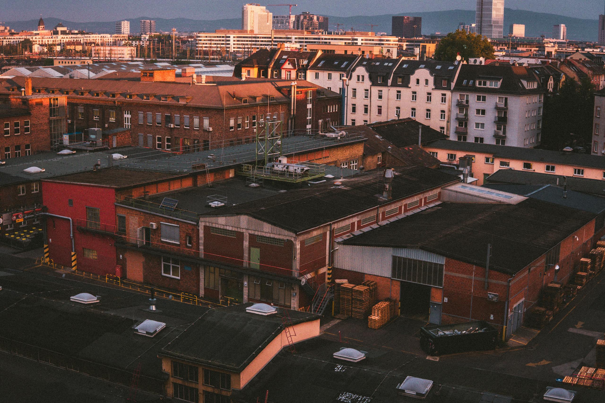 Aerial view of industrial buildings in Frankfurt am Main during sunset, showcasing urban architecture.